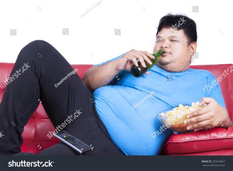 Overweight Man Sitting Lazy On Sofa Stock Photo Shutterstock