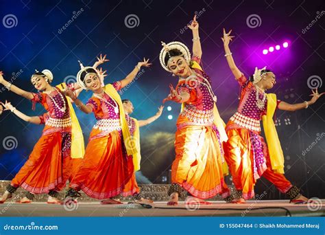 A Group Of Classical Odissi Dancers Performing Odissi Dance On Stage At