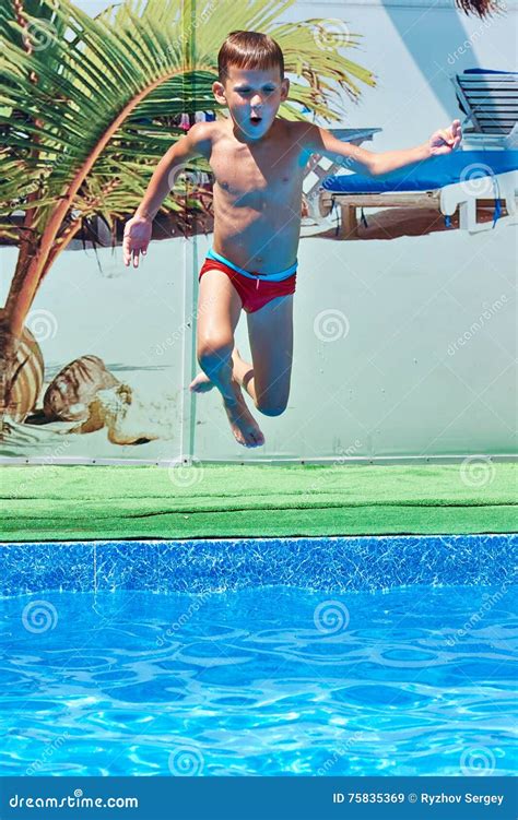 Boy Jumping Into Resort Pool Stock Image Image Of Side Leaping 75835369