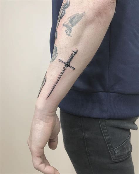 Little Sword Tattoo Inked On The Left Forearm By Mrgulliver Sword