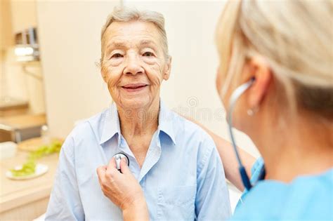 Nurse Listens To Senior Citizen Stock Image Image Of Care Apartment 134003163