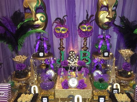 birthday masquerade party candy buffet in purple green black and gold masquerade ball