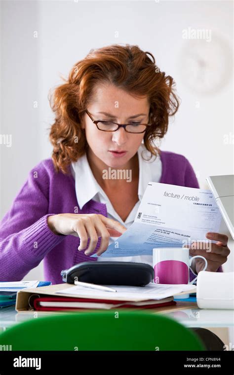 Woman Doing Paperwork Stock Photo Alamy
