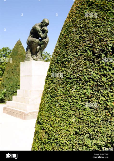Rodins Famous Sculpture The Thinker In The Rose Garden At The Musée
