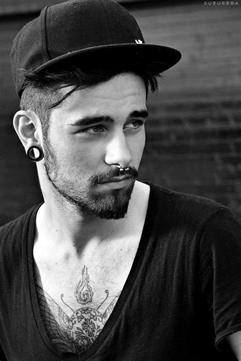 flesh tunnel and a large septum piercing men s piercings piercing hair and beard styles