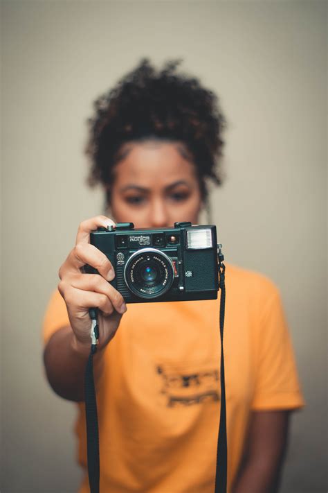 Woman Holding Camera · Free Stock Photo