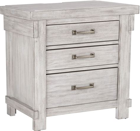 Girl's bedroom with pale gray blue walls paint color, ikea edland four poster bed, white ikea hemnes nightstand, white ikea koppang 3 drawer chest and bed in front of window with white grommet curtains window panels. Brashland White Three Drawer Nightstand from Ashley ...