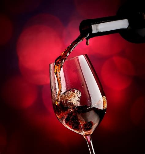 Premium Photo Red Wine In Bottle And Wineglass On Vinous Background