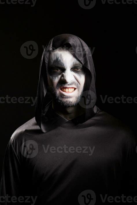 Grim Reaper With A Scary Face Isolated Over Black Background Evil Face