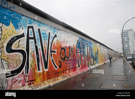 The Berlin Wall at the East Side Gallery, "Save Our Earth" graffiti