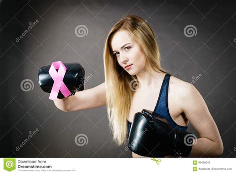 Young Woman Wearing Boxing Gloves Having Pink Ribbon Stock Photo
