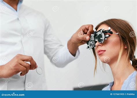 Eye Exam Woman In Glasses Checking Eyesight At Clinic Stock Image Image Of Eyes Frame 127661925