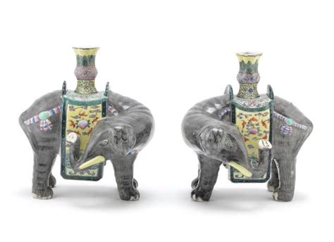 A Pair Of Famille Rose Models Of Caparisoned Elephants Supporting Vases