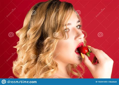 Beautiful Young Blonde Eats Strawberries With Cream Stock Image Image