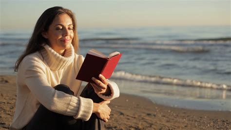 Woman Sitting On Beach Reading Book Stock Footage Sbv 300618306
