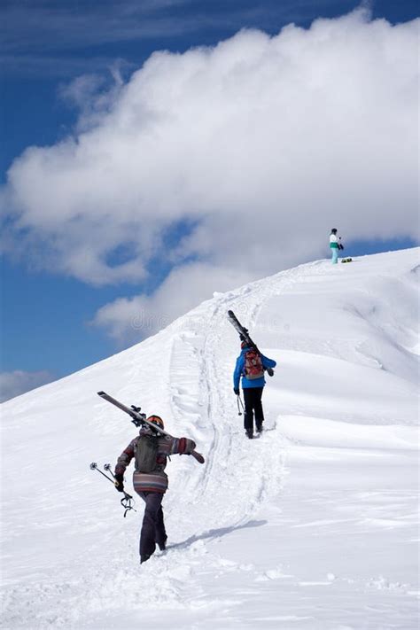 Skiers Climbing A Snowy Mountain Stock Photo Image Of Active Climb