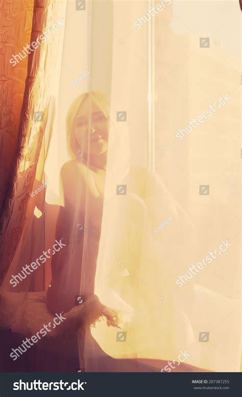 Nude Woman Sitting On Windowsill Behind Stock Photo 287387255