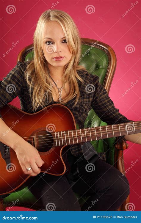 Female Guitarist Playing Electric Guitar Stock Photo CartoonDealer