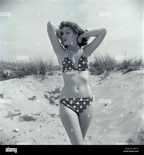 S Brunette Bathing Beauty In Polka Dot Bikini Standing In Sand With