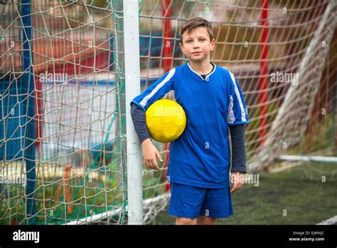 Little Boy In Goalkeeper Uniform On Football Field Stock Photo Alamy