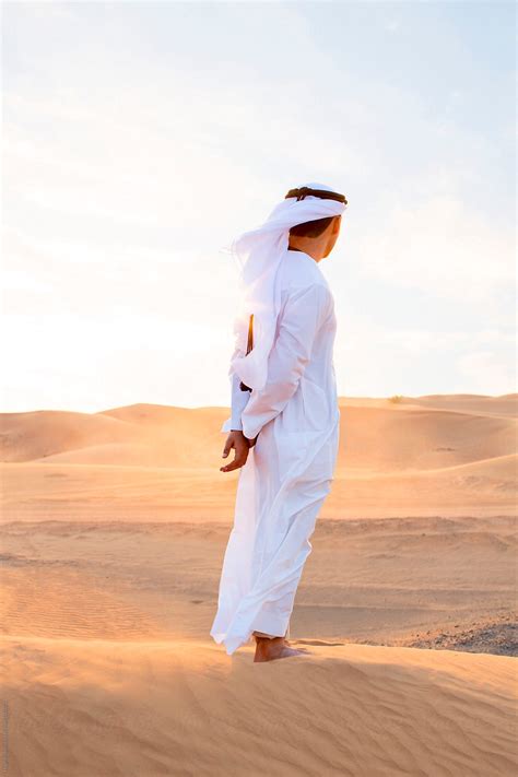Arabian Man Wearing Traditional Costume In Desert Dubai U A E By