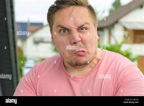Frowning Staring Hi Res Stock Photography And Images Alamy