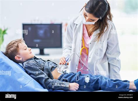 Little Boy Having Usg Examination By Pediatrician Stock Photo Alamy