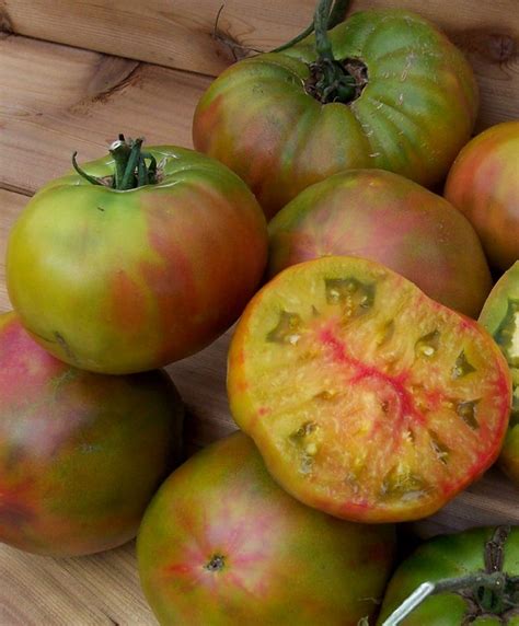 Pineapple is an heirloom garden favorite that grows to up to 2 lbs. BLACK PINEAPPLE HEIRLOOM TOMATO 80-85 days. Ananas Noir is ...