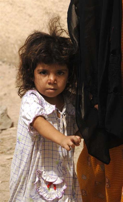 An Iraqi Girl Walks With Her Sister Through The Streets Nara And Dvids