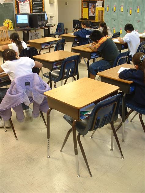 Empty Desks Show The Number Of Absent Students In A Classroom The
