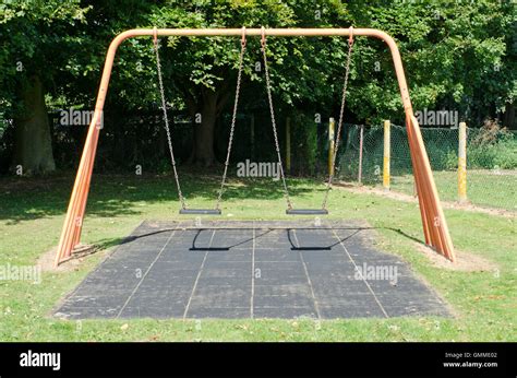 Empty Swings In A Playground Stock Photo Alamy