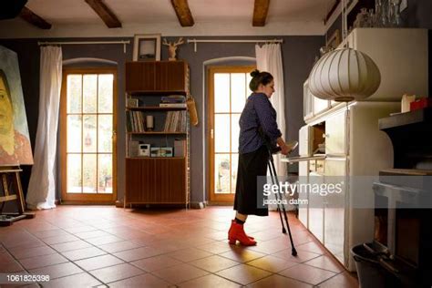 Mature Woman Crutches Photos And Premium High Res Pictures Getty Images