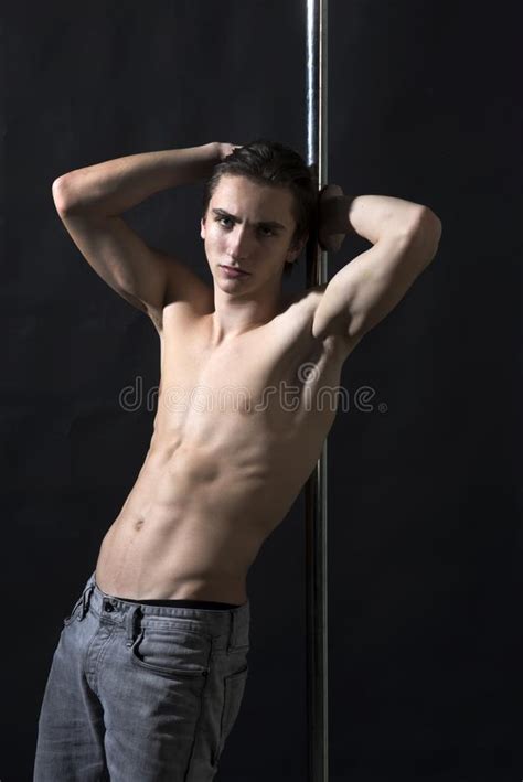Shirtless Man Pole Dancing On A Black Background Stock Photo Image Of
