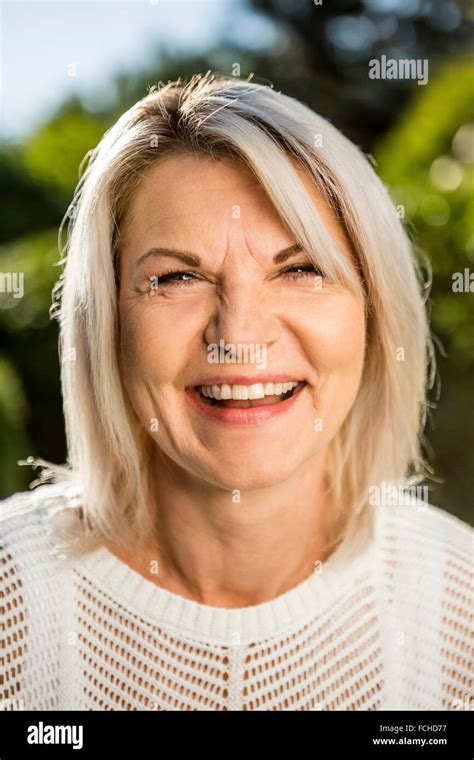 Portrait Of Smiling Mature Woman Outdoors Stock Photo Alamy
