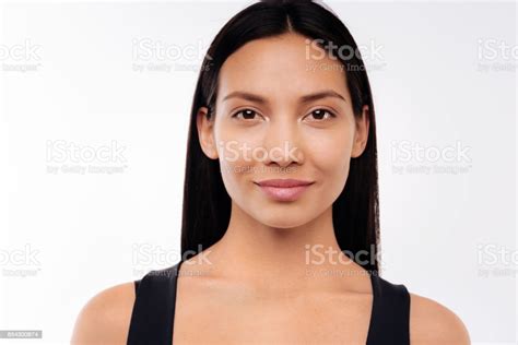 Portrait Of Beautiful Blackhaired Woman Posing On White Background