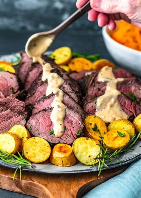 Fresh peppercorns, thyme, and bay leaves steep in the red wine and onion gravy imparting subtle but savory flavo. Beef Tenderloin | Beef tenderloin recipes, Best beef ...