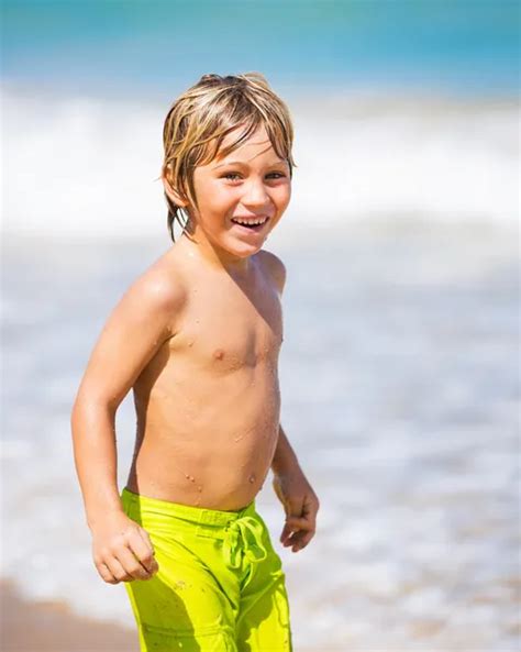 Happy Young Boy At The Beach — Stock Photo © Epicstockmedia 34824261