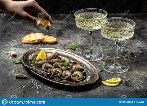Baked Snails With Butter And Spice On Dark Background Snails Baked