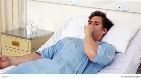 Sick Man Lying On Hospital Bed Coughing Stock Video Footage 4440087