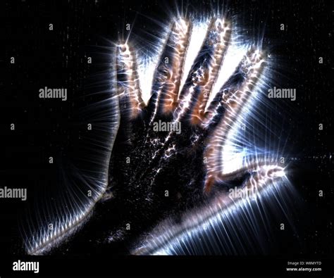 Kirlian Aura Photography Of A Glowing Human Female Hand Showing
