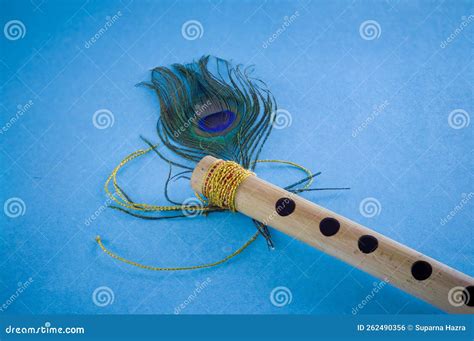 Bamboo Flute Decorated With Peacock Feather Symbolic To Hindu God Lord