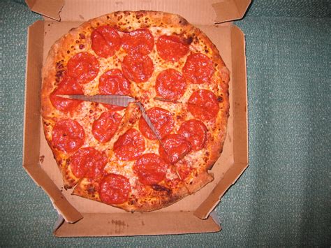 The secret to our success is the dough, which is expertly stretched until it conforms to the right size and consistency. Domino's Brooklyn Style Pizza, Whole Pie | Adam Kuban | Flickr