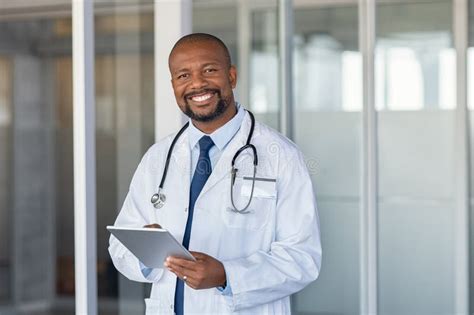 Doctor Consulting Patient Medical Record With Nurse Stock Photo Image