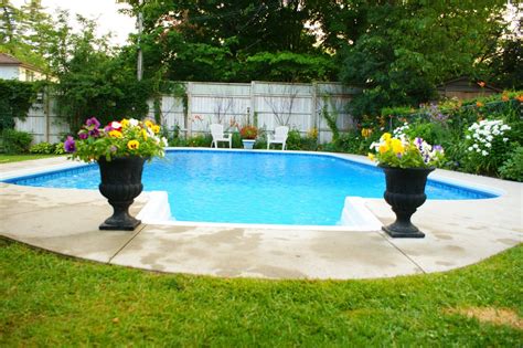 Where flower borders became famous: A perennial border to the right and back of the pool ...