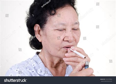 asian senior woman smoking cigarette over foto stock 742197856 shutterstock