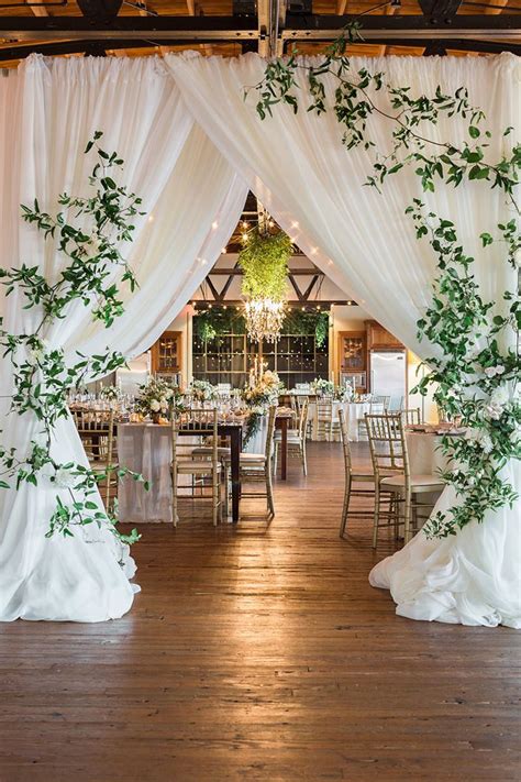 earthy and organic wedding style with modern greenery barn wedding reception greenery wedding