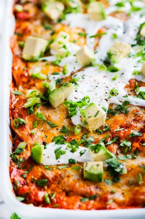 The tortillas go down first, followed by the refried beans, chicken, and cheese. Cheesy Red Chicken Enchilada Casserole - Aberdeen's Kitchen