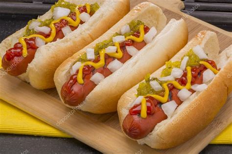 Pictures Relish Three Delicious Hot Dogs With Mustard Ketchup