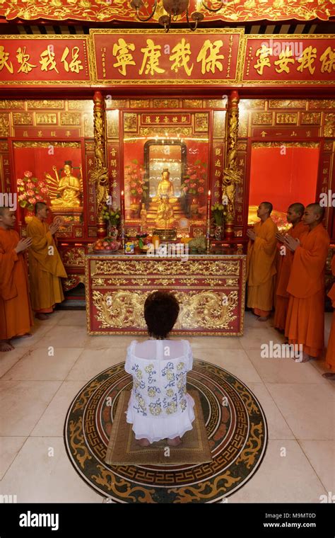 Buddhist Sacrifice Ceremony With Praying Monks And Kneeling Woman Wat Mangkon Kamalawat