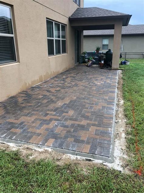 We design paver patios for any occasion. Square Paver Patio | Father & Son Landscaping, LLC